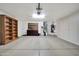 Two-car garage with built-in shelving and cabinets at 14949 W Robson Cir, Goodyear, AZ 85395