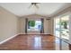 Bright Gathering room with hardwood floors, pool view, and sliding glass doors at 14949 W Robson Cir, Goodyear, AZ 85395