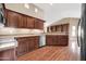 Kitchen with stainless steel appliances and wood cabinetry at 14949 W Robson Cir, Goodyear, AZ 85395