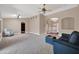Spacious living room with hardwood floors and a view to the kitchen at 14949 W Robson Cir, Goodyear, AZ 85395