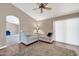 Living room with hardwood floors, neutral walls and patio access at 14949 W Robson Cir, Goodyear, AZ 85395