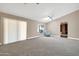 Spacious living room with sliding glass doors leading to the backyard at 14949 W Robson Cir, Goodyear, AZ 85395