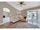 Living room with hardwood floors, neutral walls, and access to a patio at 14949 W Robson Cir, Goodyear, AZ 85395