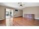 Bright main bedroom with hardwood floors and sliding door to patio at 14949 W Robson Cir, Goodyear, AZ 85395
