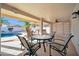 Covered patio with seating area and pool view at 14949 W Robson Cir, Goodyear, AZ 85395