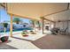 Relaxing covered patio overlooking the pool at 14949 W Robson Cir, Goodyear, AZ 85395