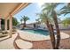 Inviting kidney-shaped pool with surrounding patio at 14949 W Robson Cir, Goodyear, AZ 85395