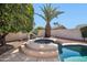 Private spa adjacent to the refreshing pool at 14949 W Robson Cir, Goodyear, AZ 85395