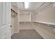 Spacious walk-in closet with double hanging rods and shelving at 14949 W Robson Cir, Goodyear, AZ 85395
