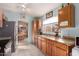 Bright kitchen featuring granite countertops and wood cabinets at 17198 N Willow Path, Surprise, AZ 85374