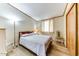 Second bedroom with wood floors and sliding door closet at 17200 W Bell Rd # 1581, Surprise, AZ 85374