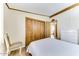 Bedroom with double bed, chair, and white dresser at 17200 W Bell Rd # 1581, Surprise, AZ 85374