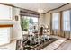 Bright dining area with glass table, chandelier, and area rug at 17200 W Bell Rd # 1581, Surprise, AZ 85374