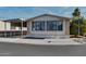 Mobile home exterior with covered carport at 17200 W Bell Rd # 1581, Surprise, AZ 85374