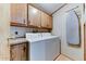 Laundry room with washer, dryer and cabinets at 17200 W Bell Rd # 1581, Surprise, AZ 85374