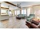 Spacious living room with hardwood floors and large windows at 17200 W Bell Rd # 1581, Surprise, AZ 85374