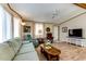 Living area with light floors, comfy seating, and a TV stand at 17200 W Bell Rd # 1581, Surprise, AZ 85374