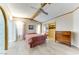 Main bedroom with a ceiling fan and built-in wardrobe at 17200 W Bell Rd # 1581, Surprise, AZ 85374