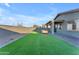 Spacious backyard with artificial turf and patio at 17574 W Cardinal Dr, Goodyear, AZ 85338