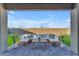 Relaxing covered patio with sectional sofa and coffee table at 17574 W Cardinal Dr, Goodyear, AZ 85338
