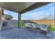 Relaxing covered patio with sectional sofa and coffee table at 17574 W Cardinal Dr, Goodyear, AZ 85338