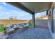 Relaxing covered patio with sectional sofa and coffee table at 17574 W Cardinal Dr, Goodyear, AZ 85338