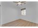 Spacious bedroom with ceiling fan and large window offering natural light at 17574 W Cardinal Dr, Goodyear, AZ 85338