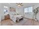 Bright bedroom with a comfortable bed and a large window at 17574 W Cardinal Dr, Goodyear, AZ 85338