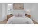 Spacious bedroom with queen bed, neutral tones, and wooden nightstands at 17574 W Cardinal Dr, Goodyear, AZ 85338