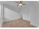 Bright bedroom with ceiling fan, window, and light wood floors at 17574 W Cardinal Dr, Goodyear, AZ 85338