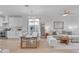 Open concept dining area with wood table and chairs, adjacent to living room at 17574 W Cardinal Dr, Goodyear, AZ 85338