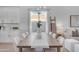 Bright dining room with a wooden table and white chairs at 17574 W Cardinal Dr, Goodyear, AZ 85338