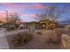 Front view of a one-story house with a two-car garage and neat landscaping at 17574 W Cardinal Dr, Goodyear, AZ 85338