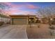 One-story home with a two-car garage and desert landscaping at 17574 W Cardinal Dr, Goodyear, AZ 85338