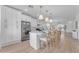 Modern kitchen with white cabinets, island, and stainless steel appliances at 17574 W Cardinal Dr, Goodyear, AZ 85338