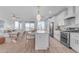 Modern kitchen featuring white cabinets, a large island, and stainless steel appliances at 17574 W Cardinal Dr, Goodyear, AZ 85338