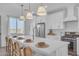 Kitchen island with seating and a modern gold faucet at 17574 W Cardinal Dr, Goodyear, AZ 85338