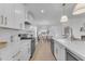 Modern kitchen with white cabinets and stainless steel appliances at 17574 W Cardinal Dr, Goodyear, AZ 85338