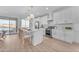 Modern kitchen with white cabinets, an island, and stainless steel appliances at 17574 W Cardinal Dr, Goodyear, AZ 85338