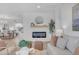 Living room with fireplace, neutral decor, and natural light at 17574 W Cardinal Dr, Goodyear, AZ 85338