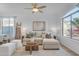 Bright living room featuring a comfortable sectional sofa and large window at 17574 W Cardinal Dr, Goodyear, AZ 85338