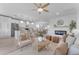 Open living room with fireplace and neutral color palette at 17574 W Cardinal Dr, Goodyear, AZ 85338