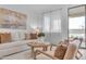 Light-filled living room with modern furniture and access to a patio at 17574 W Cardinal Dr, Goodyear, AZ 85338