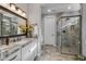 Spa-like bathroom with a large walk-in shower, granite vanity, and updated fixtures at 17848 E Stocking Trl, Rio Verde, AZ 85263