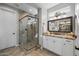 Modern bathroom with a walk-in shower, granite countertop vanity, and elegant tile at 17848 E Stocking Trl, Rio Verde, AZ 85263