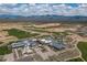 Aerial view of community amenities including clubhouse and golf course at 17848 E Stocking Trl, Rio Verde, AZ 85263
