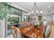 Spacious dining room features a large table and access to a backyard patio at 17848 E Stocking Trl, Rio Verde, AZ 85263
