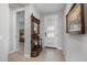 Bright entryway with hardwood floors and coat rack at 17848 E Stocking Trl, Rio Verde, AZ 85263