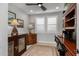 Bright home office features built-in shelving and hardwood floors at 17848 E Stocking Trl, Rio Verde, AZ 85263
