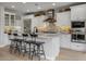 Modern kitchen with white cabinets, granite countertops, and island at 17848 E Stocking Trl, Rio Verde, AZ 85263